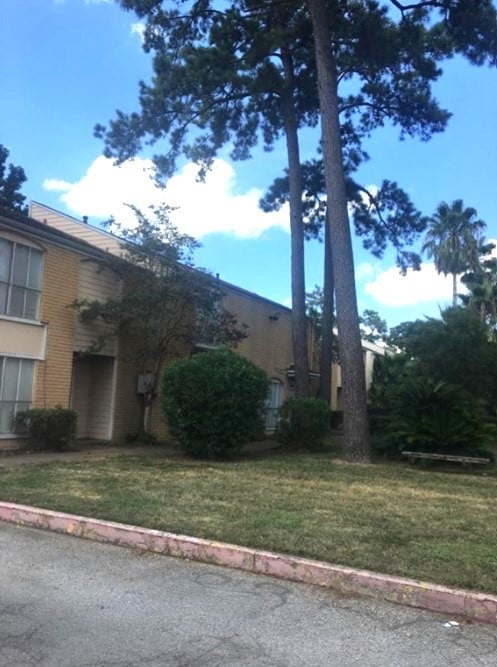 view of property exterior featuring a lawn