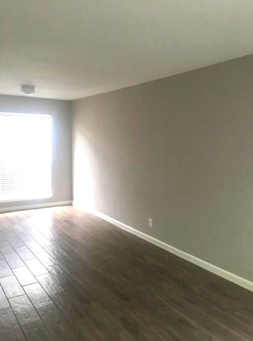 empty room with wood-type flooring