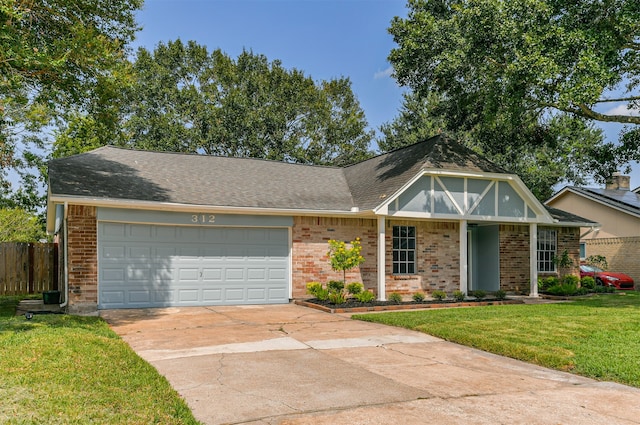 view of front of home with a garage and a front yard