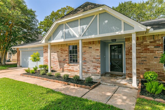 view of front of home featuring a garage and covered porch