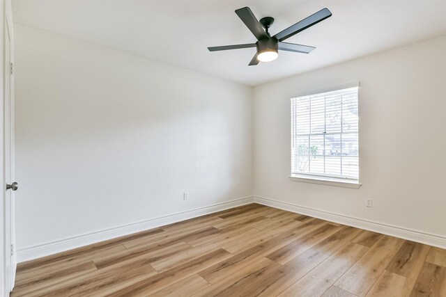 unfurnished room with ceiling fan and light hardwood / wood-style floors