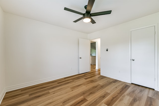 unfurnished bedroom featuring ceiling fan and light hardwood / wood-style flooring