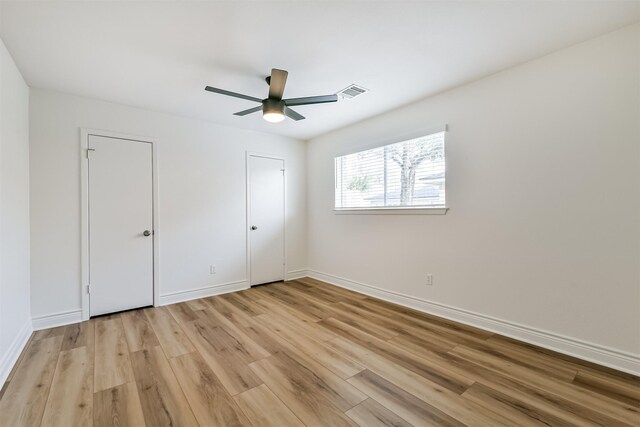 unfurnished bedroom featuring light hardwood / wood-style floors and ceiling fan