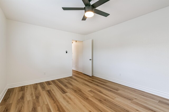 empty room with light hardwood / wood-style floors and ceiling fan