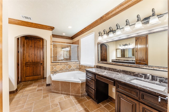 full bath featuring stone tile flooring, visible vents, a stall shower, vanity, and a bath