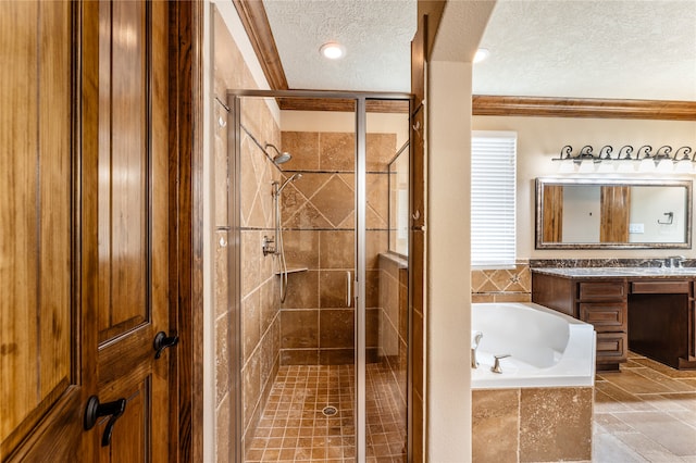 bathroom featuring a textured ceiling, vanity, a shower stall, and a bath