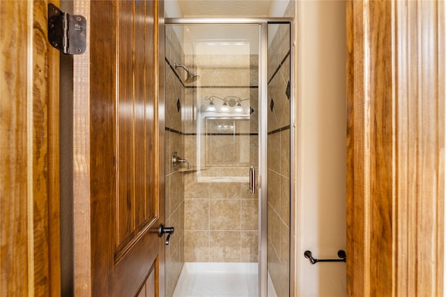 bathroom with a shower stall