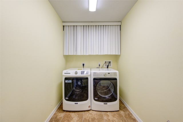 clothes washing area featuring washing machine and clothes dryer