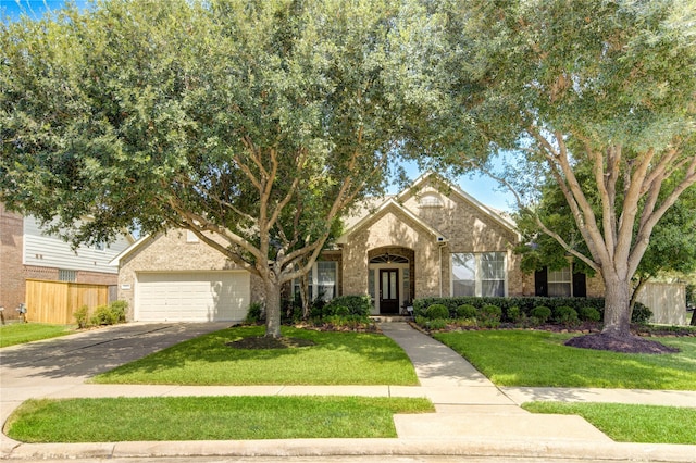 view of front facade with a garage and a front lawn