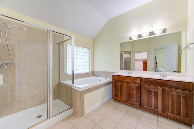 bathroom with vanity, lofted ceiling, plus walk in shower, and tile patterned floors