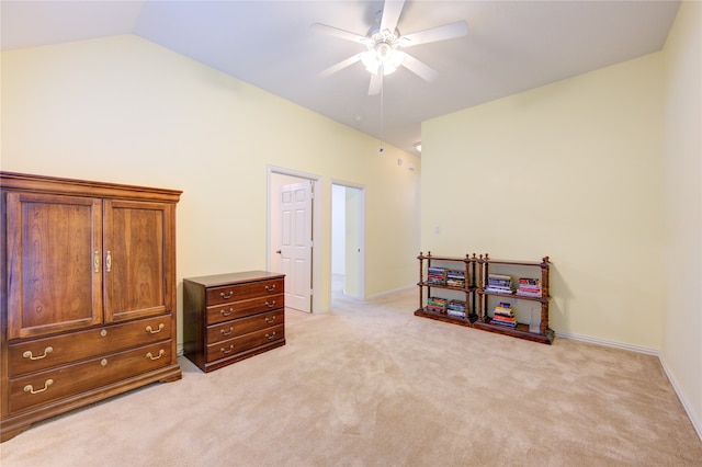 misc room with lofted ceiling, ceiling fan, and light carpet