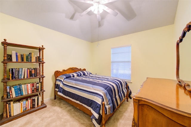 bedroom featuring ceiling fan and light carpet