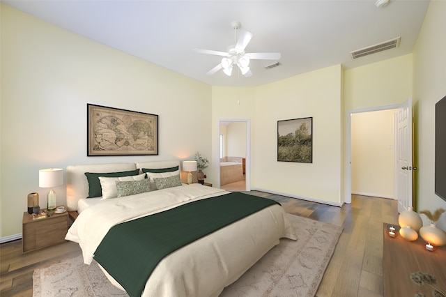 bedroom with ceiling fan, hardwood / wood-style flooring, and connected bathroom