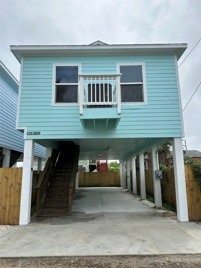 view of front of home featuring a carport