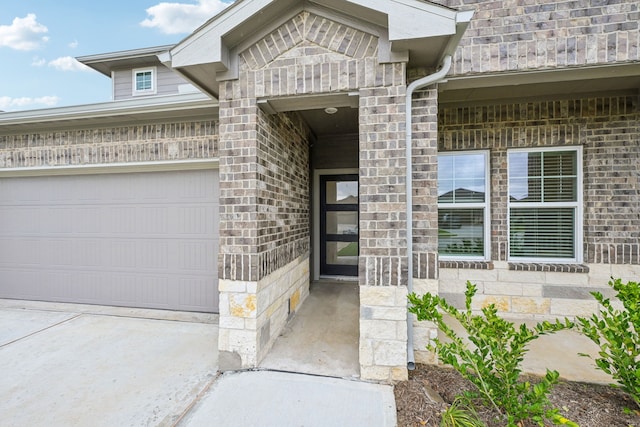 view of exterior entry featuring a garage