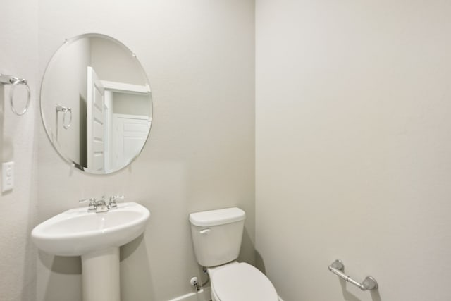 bathroom with sink and toilet