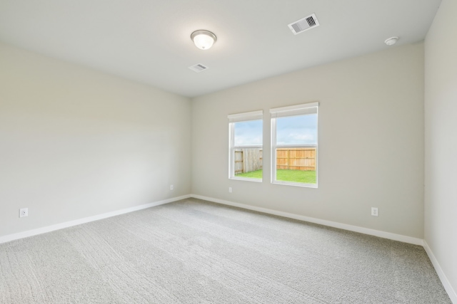 unfurnished room featuring carpet floors