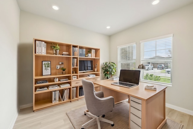 office area with light hardwood / wood-style flooring