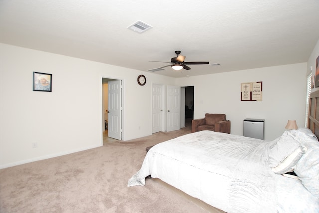 carpeted bedroom featuring ceiling fan