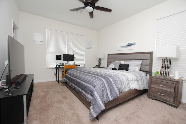 bedroom with light colored carpet and ceiling fan