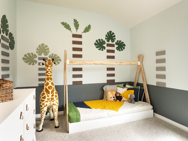 bedroom with carpet and lofted ceiling