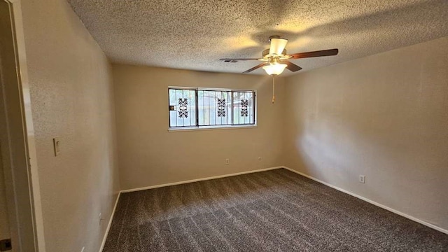 carpeted spare room featuring ceiling fan and a textured ceiling