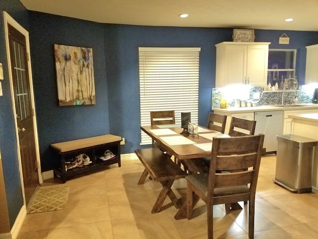 tiled dining room with sink