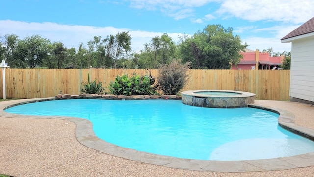 view of pool featuring an in ground hot tub