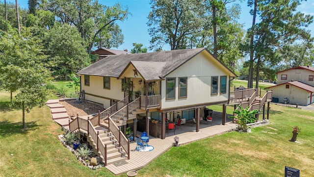 back of property featuring a lawn and a deck