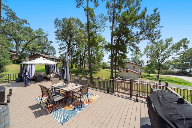 wooden deck featuring a yard