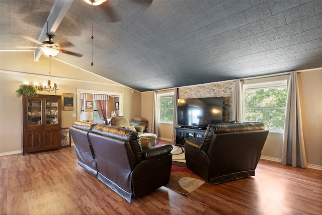 living room featuring ceiling fan, hardwood / wood-style flooring, lofted ceiling with beams, and a healthy amount of sunlight