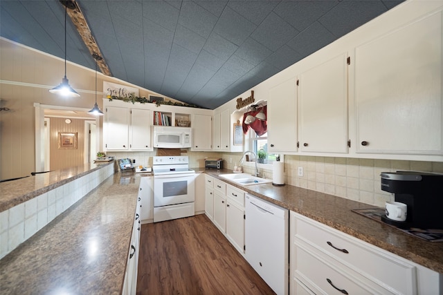 kitchen with decorative backsplash, white cabinets, sink, white appliances, and lofted ceiling with beams