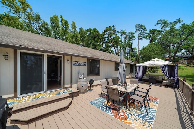 deck featuring a gazebo and an outdoor living space