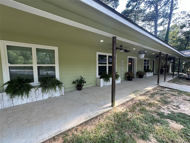 exterior space with a patio area and ceiling fan