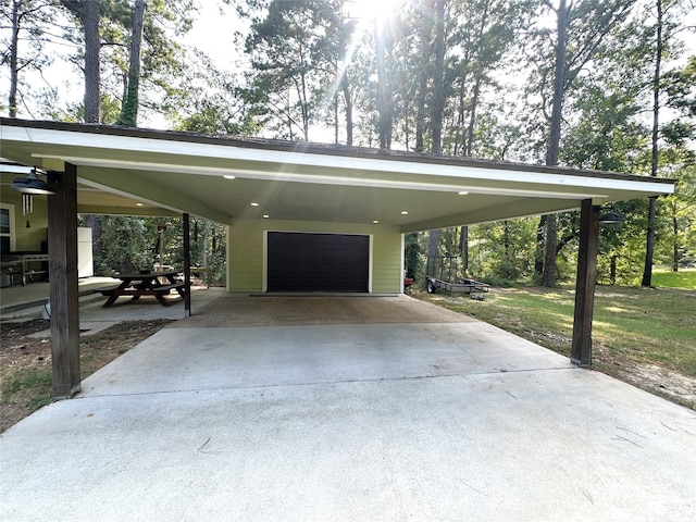 exterior space with a lawn, a carport, and a garage