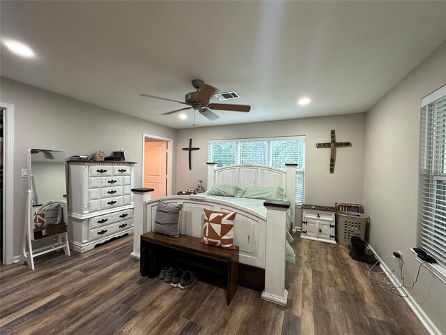 bedroom with ceiling fan and dark hardwood / wood-style floors