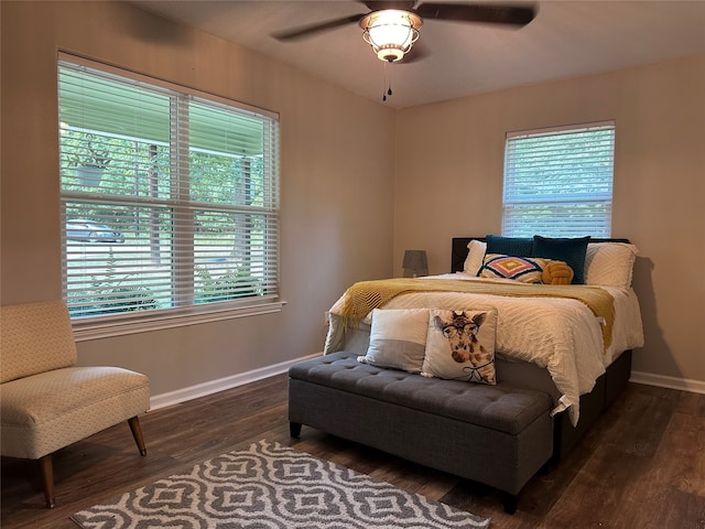 bedroom featuring dark hardwood / wood-style flooring and ceiling fan