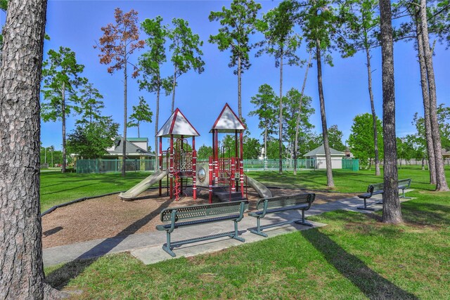 view of jungle gym featuring a yard