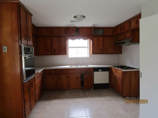 kitchen featuring extractor fan, stainless steel oven, dishwasher, light tile patterned floors, and sink