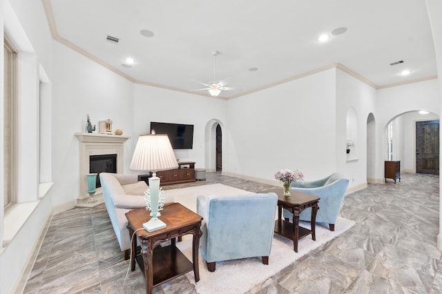 tiled living room featuring ceiling fan and crown molding