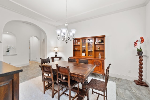 tiled dining space featuring an inviting chandelier