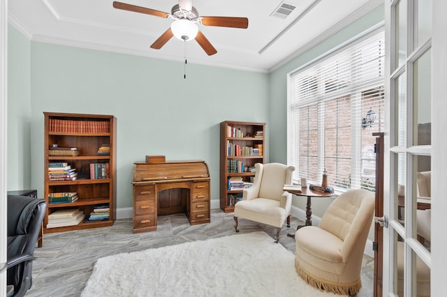 sitting room with ceiling fan and crown molding