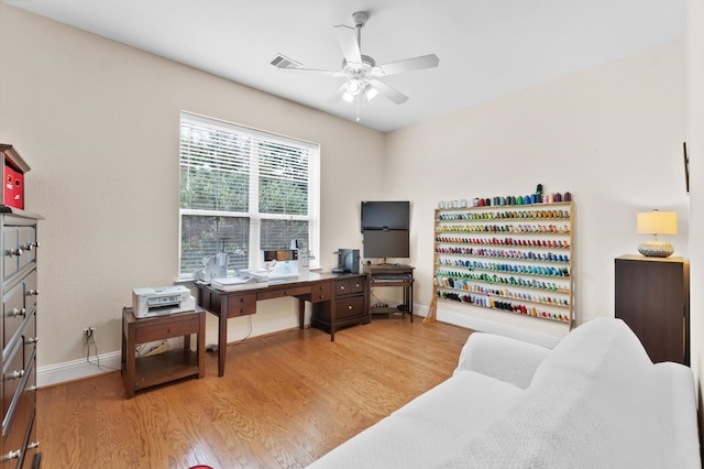 office featuring light wood-type flooring and ceiling fan