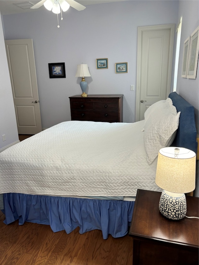 bedroom featuring hardwood / wood-style flooring and ceiling fan