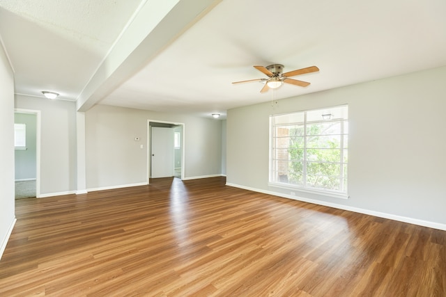 empty room with light wood-type flooring and ceiling fan