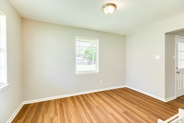 spare room featuring light hardwood / wood-style floors