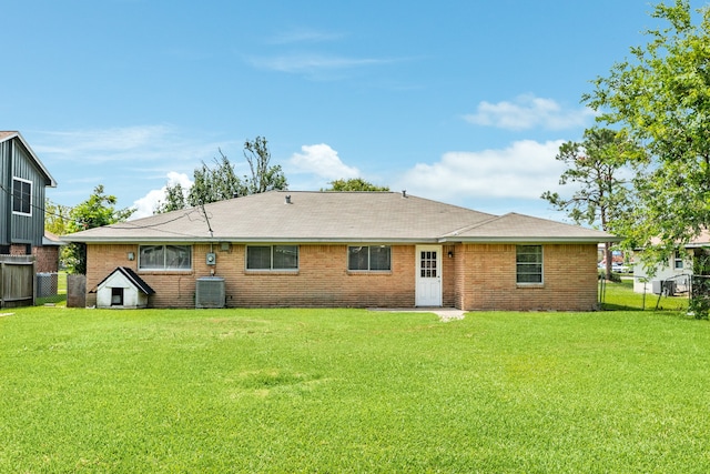 back of house with a yard