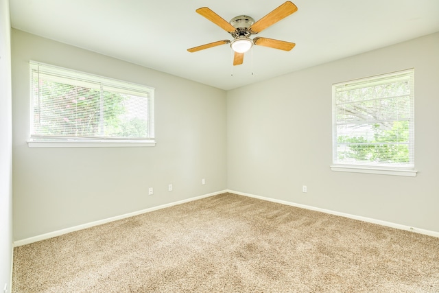 carpeted empty room with ceiling fan