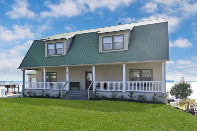 view of front of home with a porch and a front yard