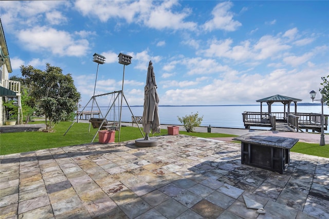 view of patio / terrace featuring a gazebo and a water view